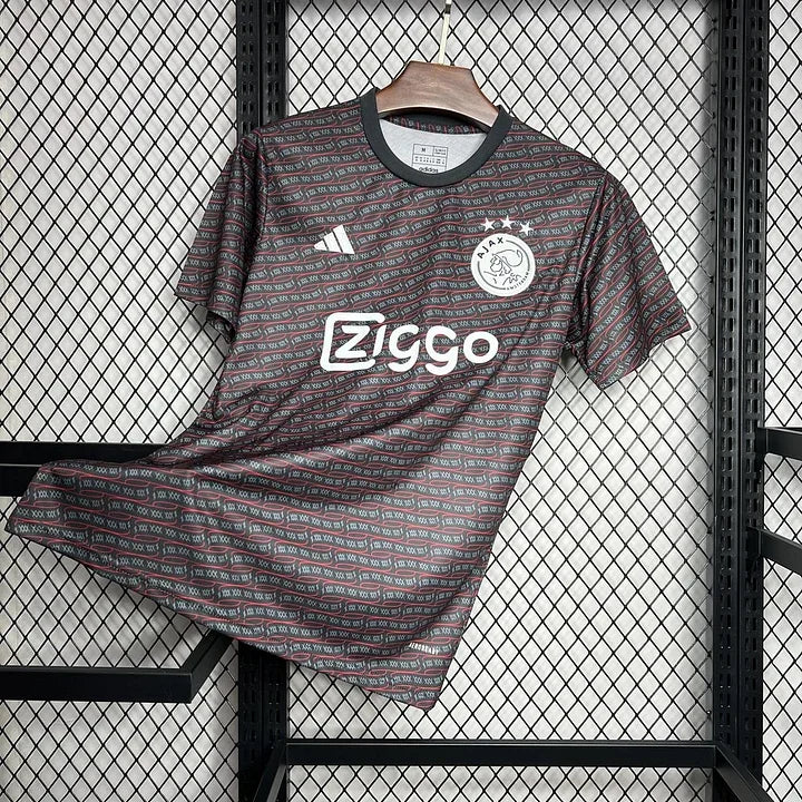 Maillot AJAX Amsterdam foot Prématch 2024 2025 de Le 12, maillot de football orange avec logo et détails sportifs.