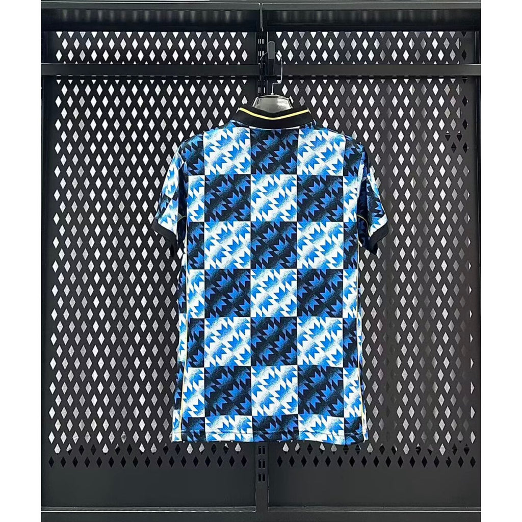 Maillot Manchester United 25/26 bleu, marque Le 12-ème Maillot, vêtement de football pour jeunes garçons.