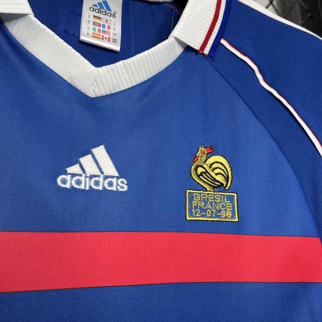 Maillot France 1998 rétro de la marque Le 12-ème Maillot, vue frontale avec logo et design vintage bleu, blanc, rouge.