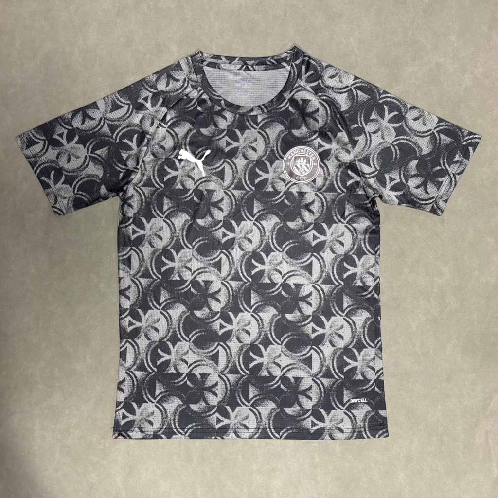 Maillot Manchester City 25/26 Le 12-ème Maillot gris pour enfants, vue de face, détails du logo et design sportif.