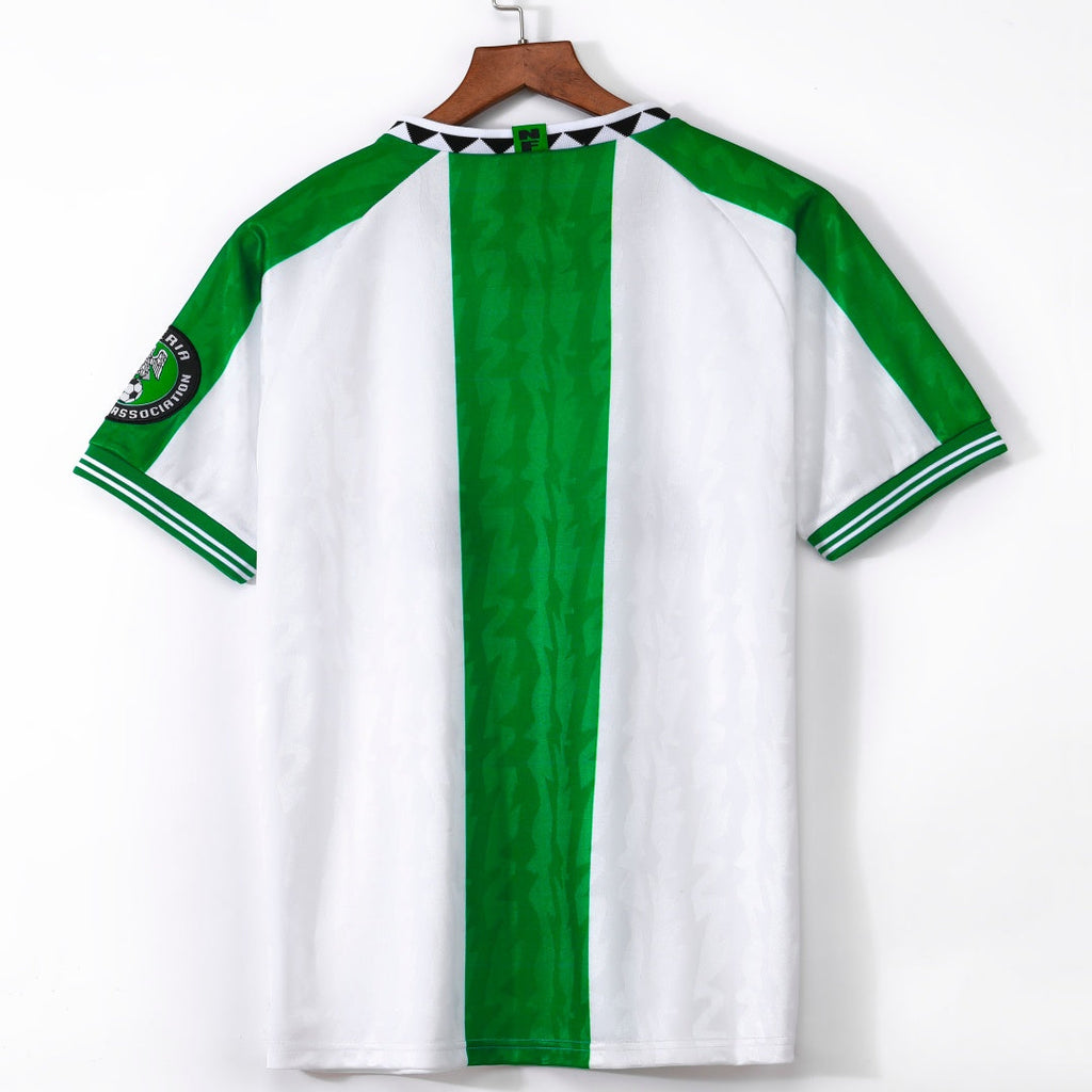 Maillot extérieur Nigeria 1996 rétro de la marque Le 12, maillot de football vintage avec logo et design coloré.