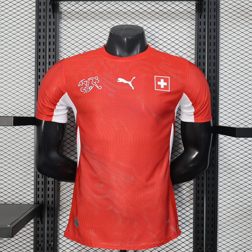 Maillot Suisse Coupe du Monde 2026 Le 12 -ème Maillot, maillot de football avec drapeau suisse et logo officiel.