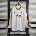 Maillot manches longues Real Madrid 2023-2024, marque Le 12 -ème Maillot, en tissu blanc avec logo et détails du club.
