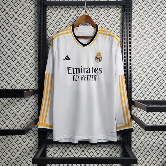 Maillot manches longues Real Madrid 2023-2024, marque Le 12 -ème Maillot, en tissu blanc avec logo et détails du club.