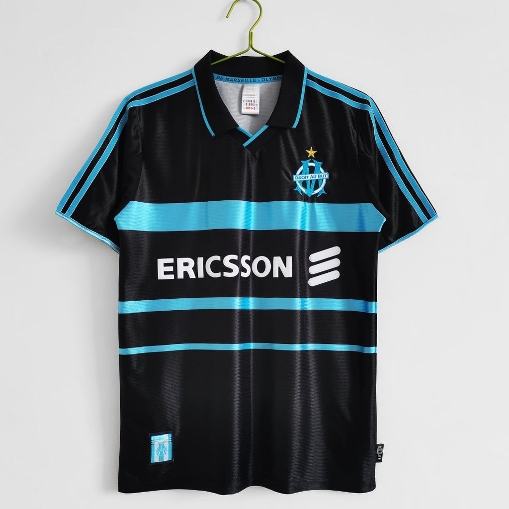 Maillot rétro de football Marseille 1999-2000, troisième maillot de la marque Le 12 -ème Maillot, vue de face avec logo et détails colorés