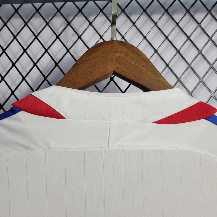 Maillot rétro de l'équipe de France 2006, modèle Le 12 -ème Maillot, avec logo et design officiel visible.
