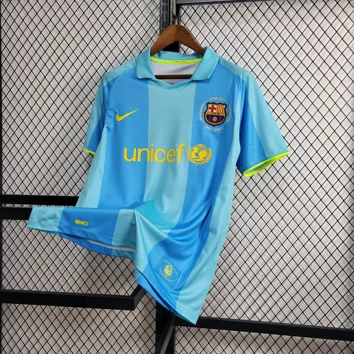 Maillot rétro FC Barcelone 2007-2008 de la marque Le 12, maillot de football avec logo et détails colorés.