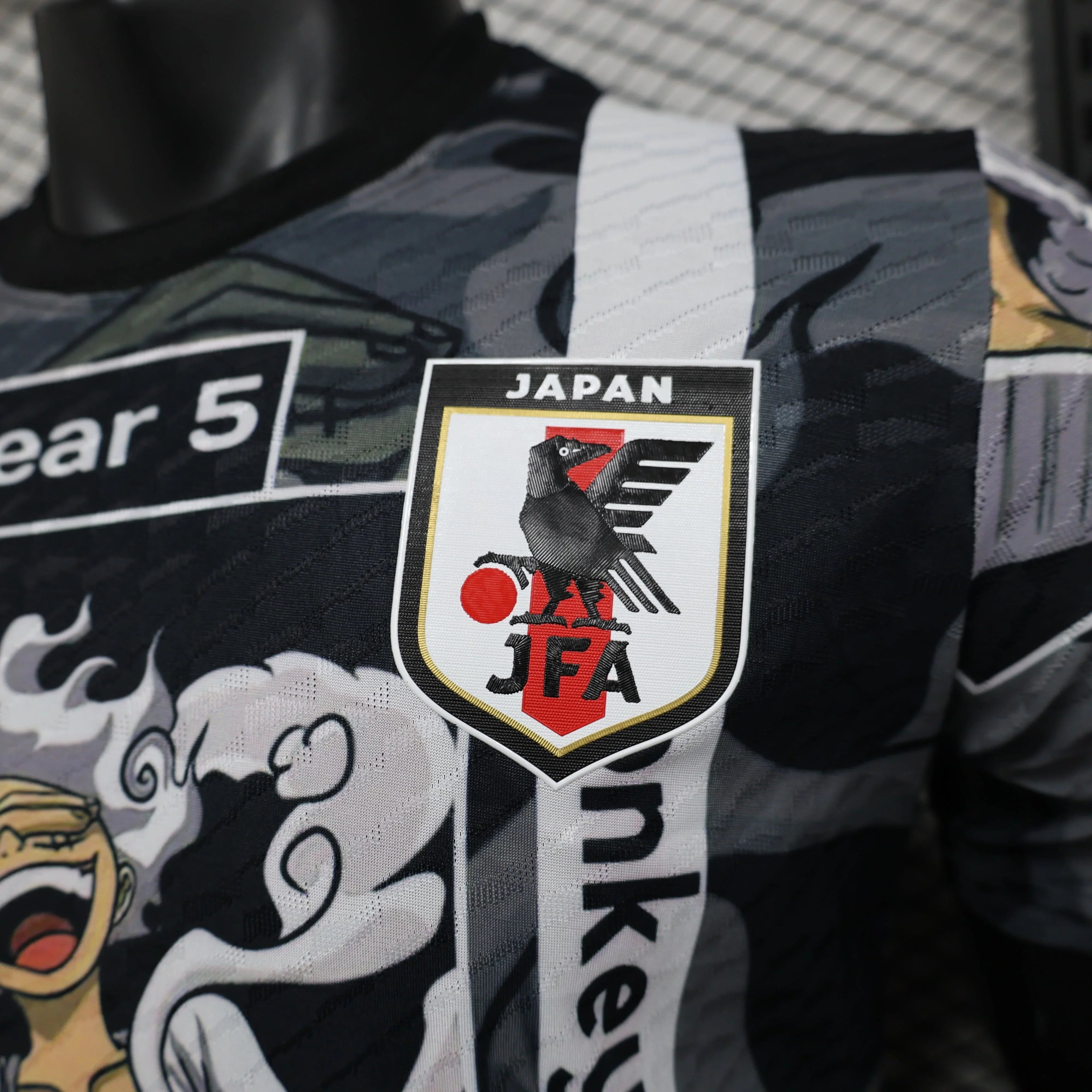 Maillot Japon Concept 2025-2026 de Le 12 -ème Maillot, vue front avec logo et design moderne sur tissu bleu.