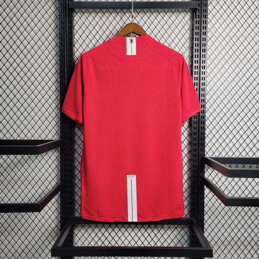 Maillot domicile rétro Manchester United 2007-2008, marque Le 12 -ème Maillot, vue de face avec logo et détails de l'équipe.