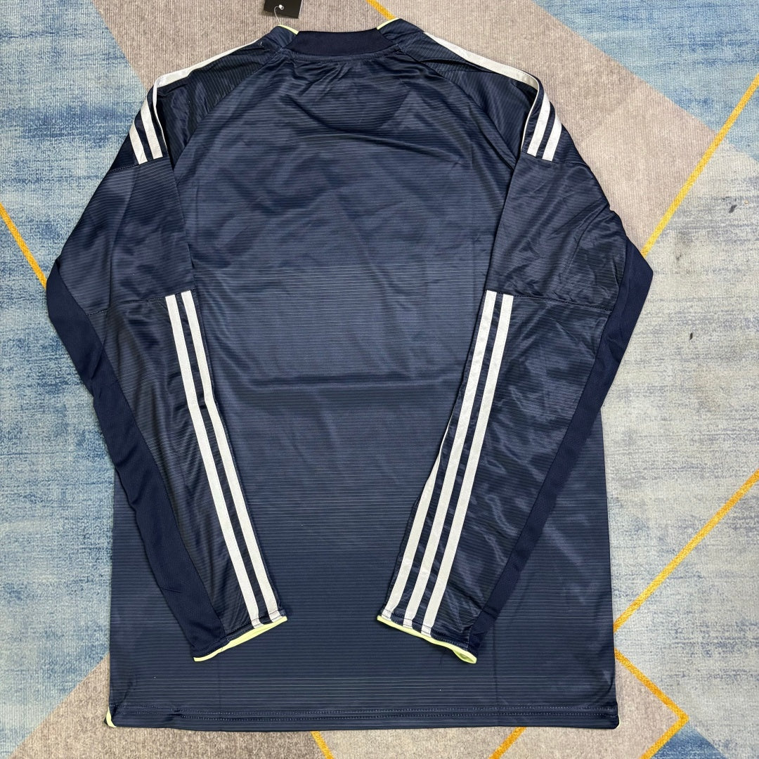 Maillot extérieur manches longues Real Madrid 25/26, marque Le 12 -ème Maillot, vue de face avec logo et détails du design.