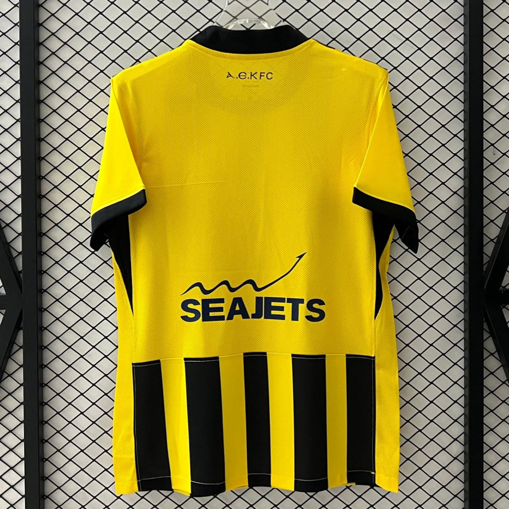 Maillot domicile 25/26 AEK Athens Le 12 -ème Maillot, maillot de football bleu avec logo de l'équipe et détails du design.