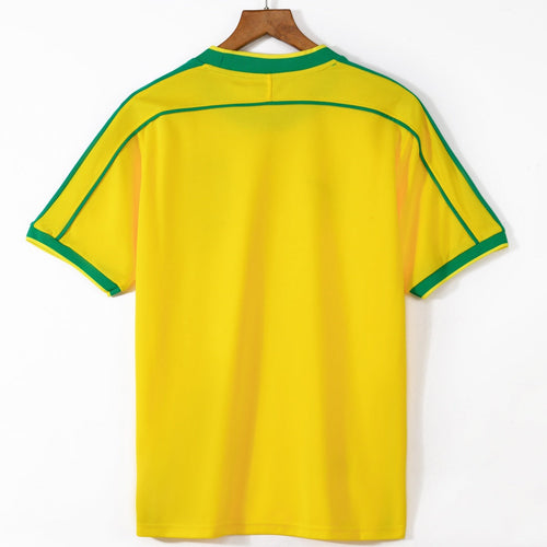 Maillot domicile Brésil rétro 1998, marque Le 12 -ème Maillot, vue de face avec logo et détails du maillot.