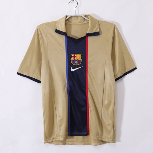 Maillot extérieur rétro du FC Barcelone 2001-2002, version de Le 12, avec logo et couleurs traditionnelles blaugrana.