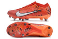 Crampons Mercurial Vapor XV Elite pour football, semelles en métal avec pointes pour adhérence sur terrain naturel.