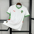 Maillot extérieur du Maroc CAN 2025-26, modèle Le 12 -ème Maillot, vue de face avec logo officiel et détails du design.