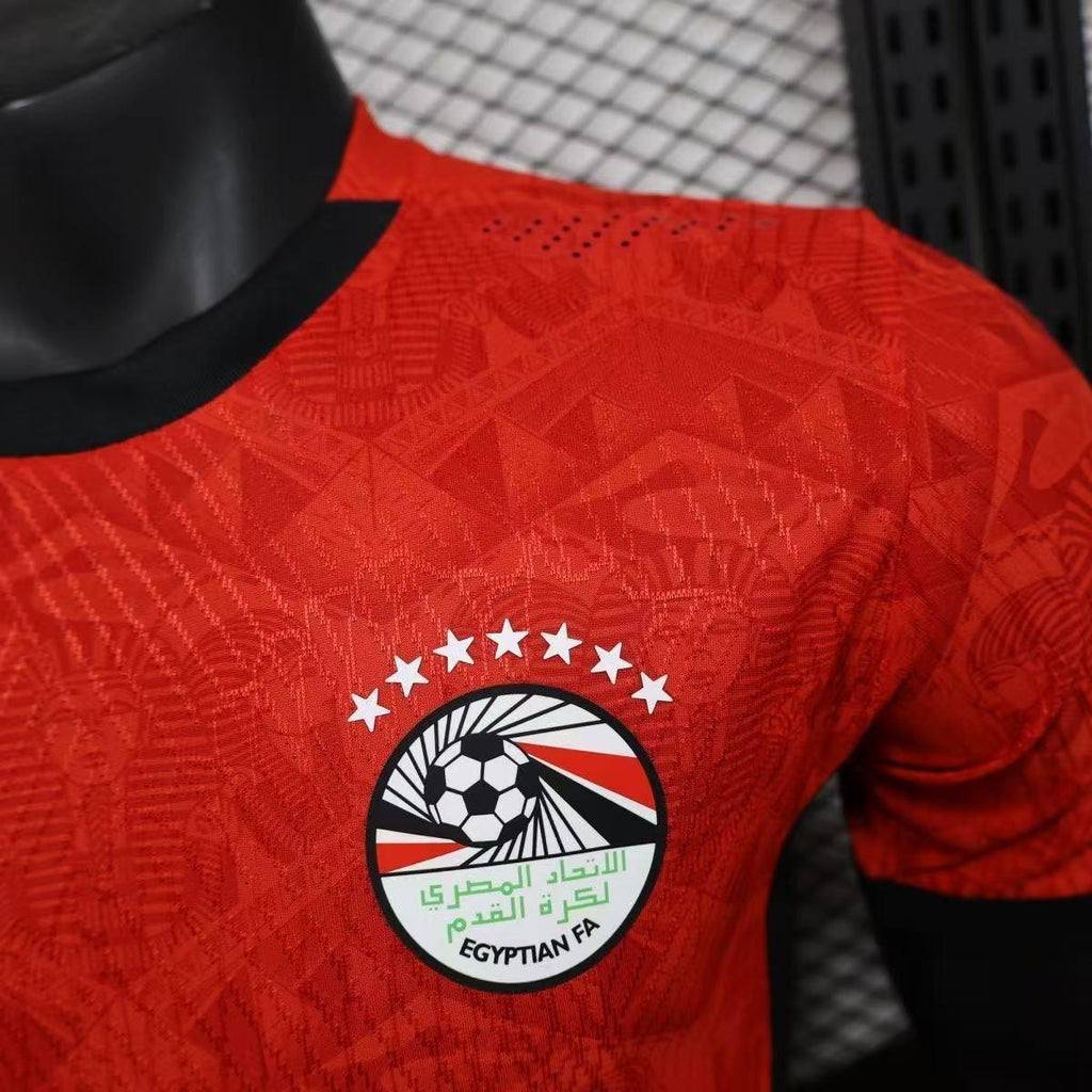 Maillot de football Égypte CAN 2025-26 Le 12 -ème Maillot, maillot orange avec logo et détails sportifs.