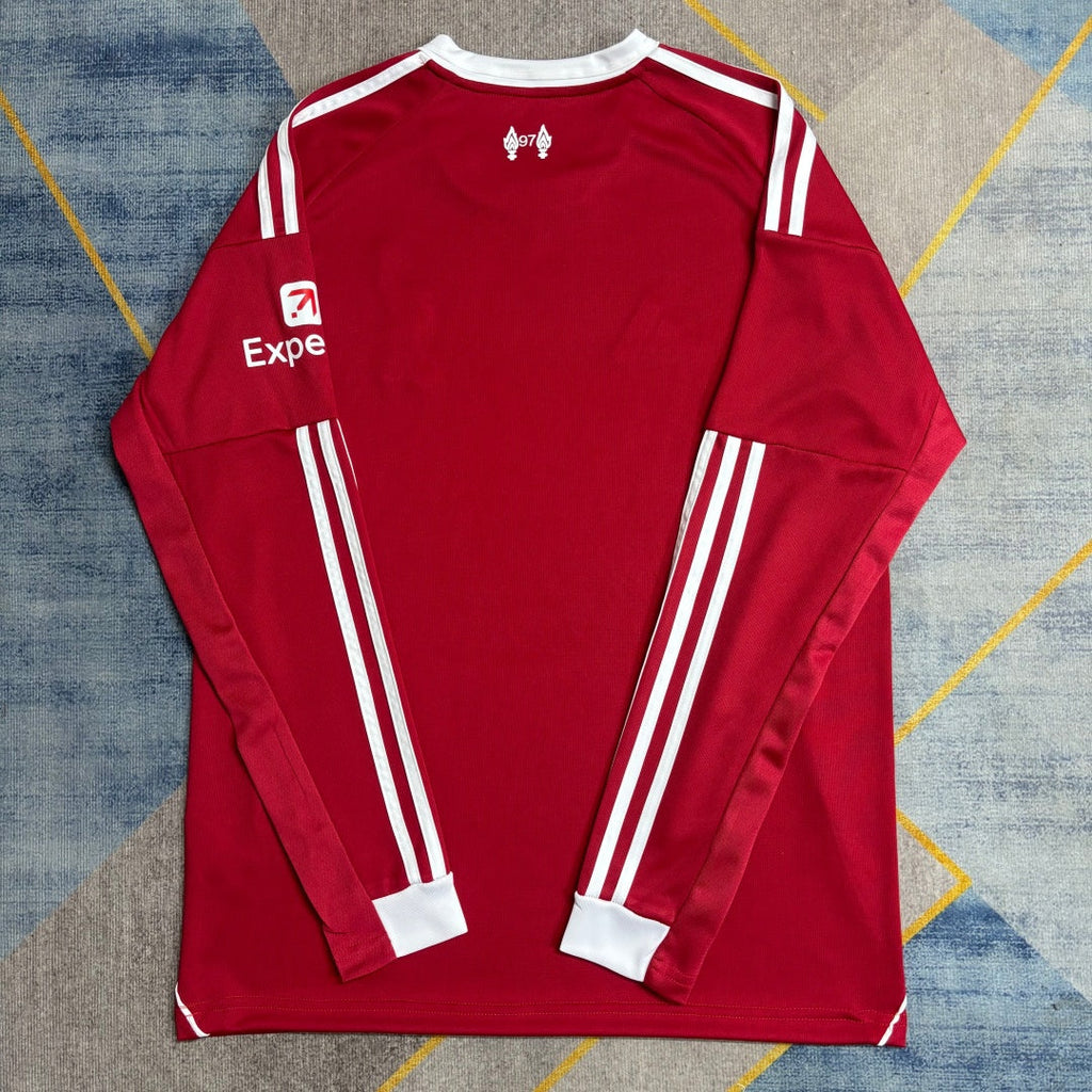 Maillot domicile Liverpool 25/26 à manches longues, marque Le 12 -ème Maillot, en bleu avec logo de l'équipe.