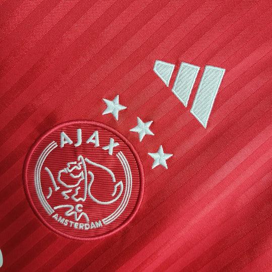 Maillot domicile Ajax 2023-2024 Le 12 -ème Maillot, maillot de football avec logo Ajax et couleurs traditionnelles.