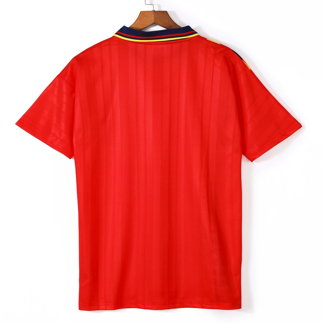Maillot domicile de l'Espagne 1994-1995 de la marque Le 12, rétro, avec les couleurs traditionnelles et le logo officiel.