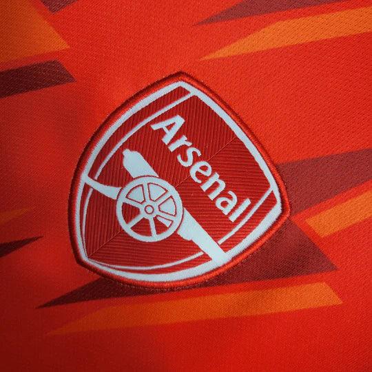 Maillot d'entraînement Arsenal 2023-2024 Le 12, maillot de football avec logo et design moderne, vue de face.