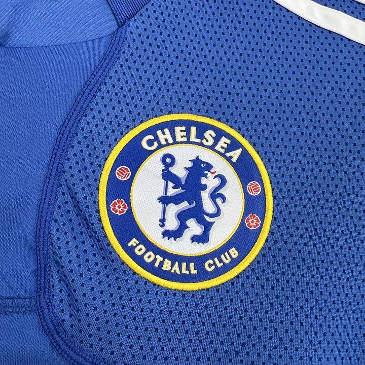 Maillot Chelsea de football rétro 2009-2010, marque Le 12-ème, vue de face avec logo et détails du maillot.