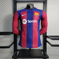 Maillot FC Barcelone manches longues 2023-24 Le 12 -ème Maillot, maillot de football bleu avec logo et détails du club.