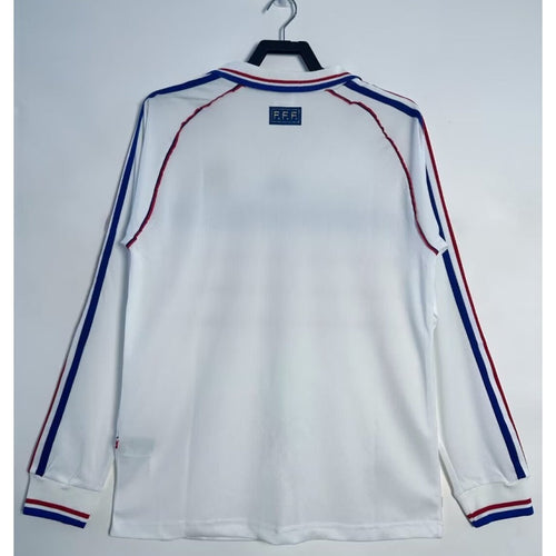 Maillot extérieur de football France 1998, manches longues, style rétro, en bleu avec logo de l'équipe nationale.
