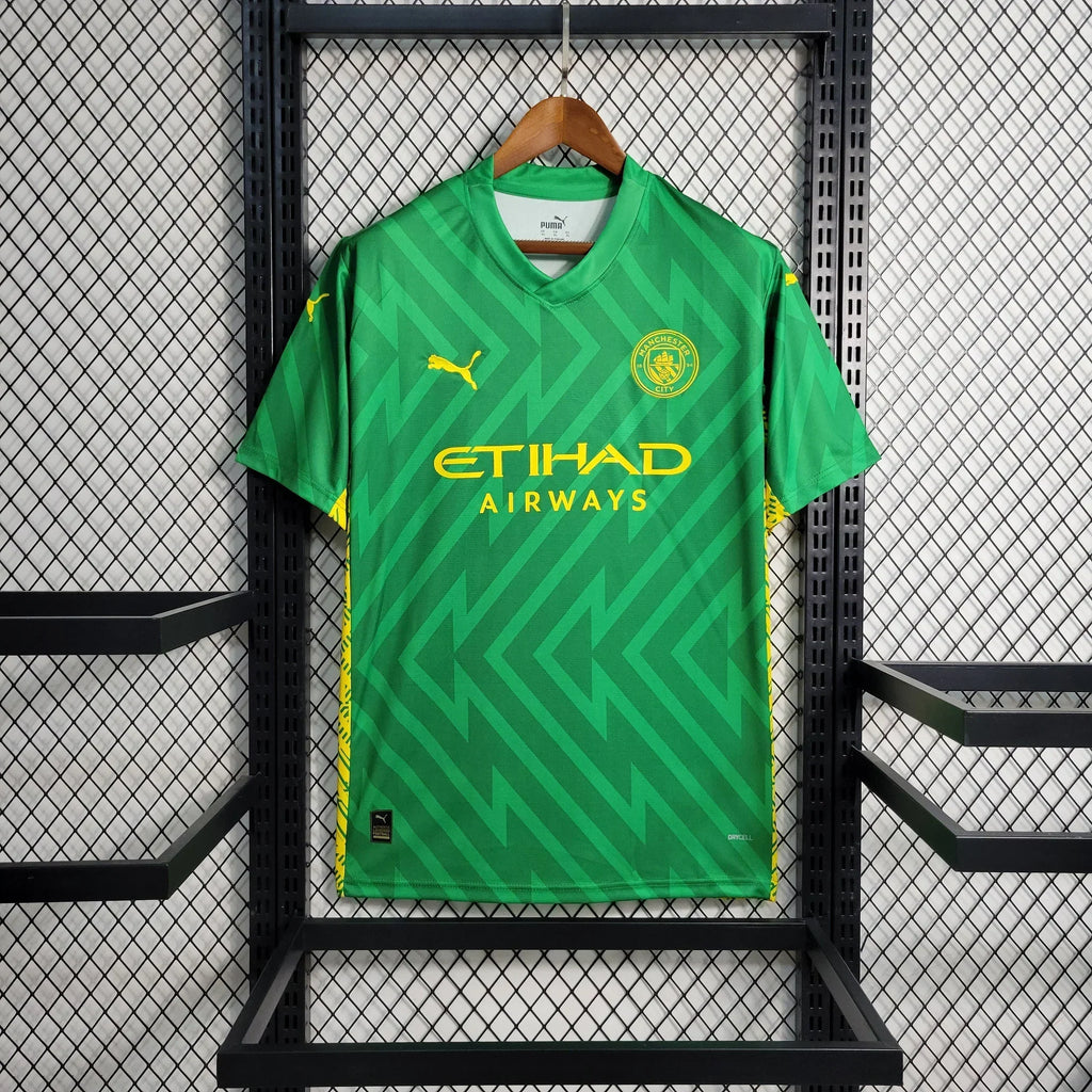 Maillot de gardien Manchester City 2023-2024 Le 12 -ème Maillot, tissu bleu avec logo et détails en blanc.