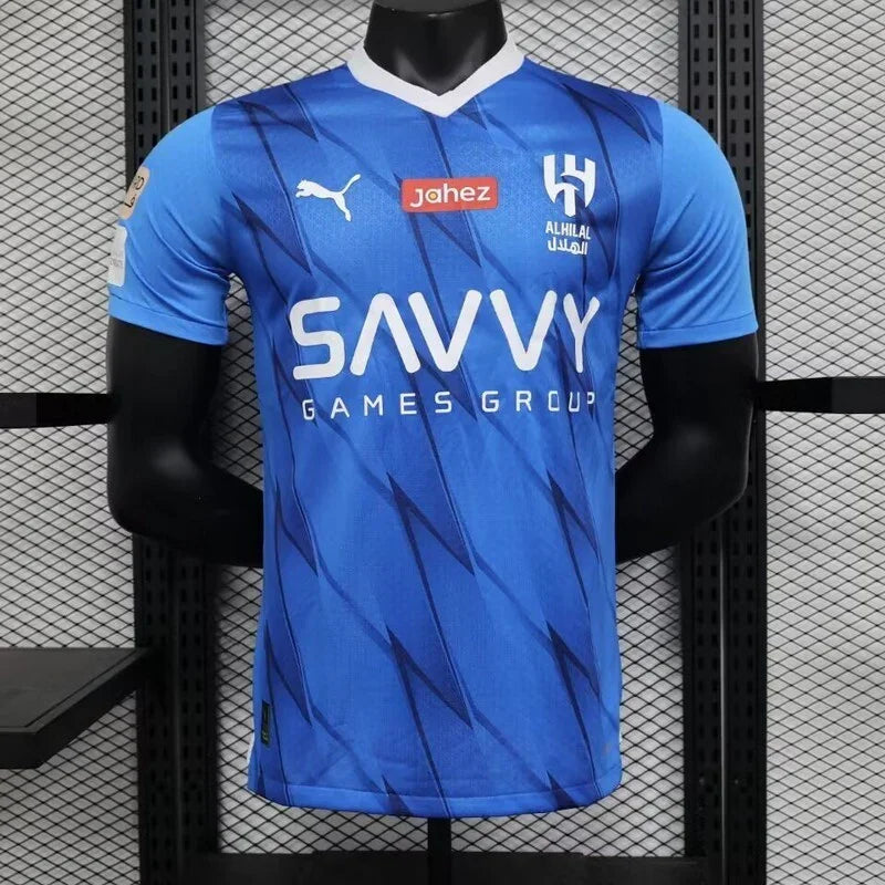 Maillot de football AL-Hilal 2023-24, marque Le 12 -ème Maillot, vue de face avec logo et détails du maillot.