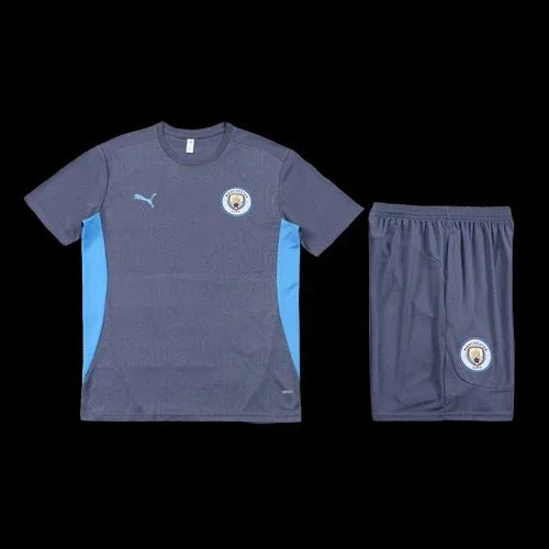Ensemble Manchester City Le 12 -ème Maillot, maillot de football bleu avec logo de l'équipe et détails blancs.
