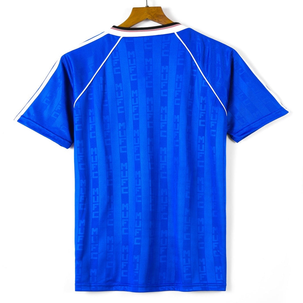 Maillot Manchester United third rétro 1988-1990, en maillot Le 12-ème Maillot, vue de face avec logo et détails du design.