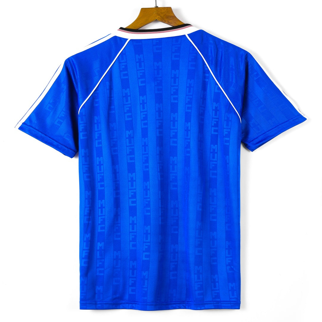 Maillot Manchester United third rétro 1988-1990, en maillot Le 12-ème Maillot, vue de face avec logo et détails du design.