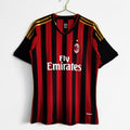 Maillot domicile rétro de l'AC Milan 2013-2014, marque Le 12ème Maillot, avec logo et design classique rouge et noir.