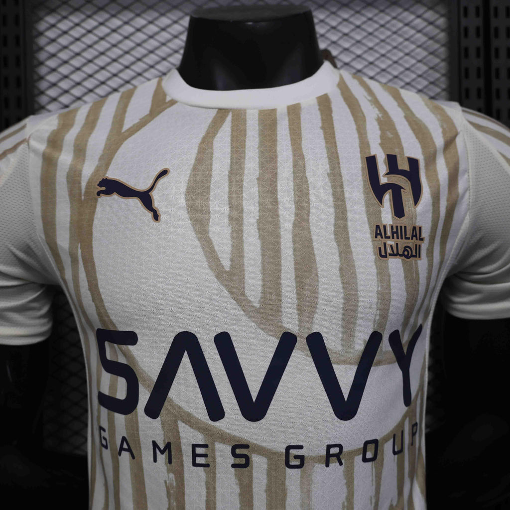 Maillot extérieur de football Al-Hilal 2025-26, marque Le 12 –ème Maillot, vue de face avec logo et design coloré.