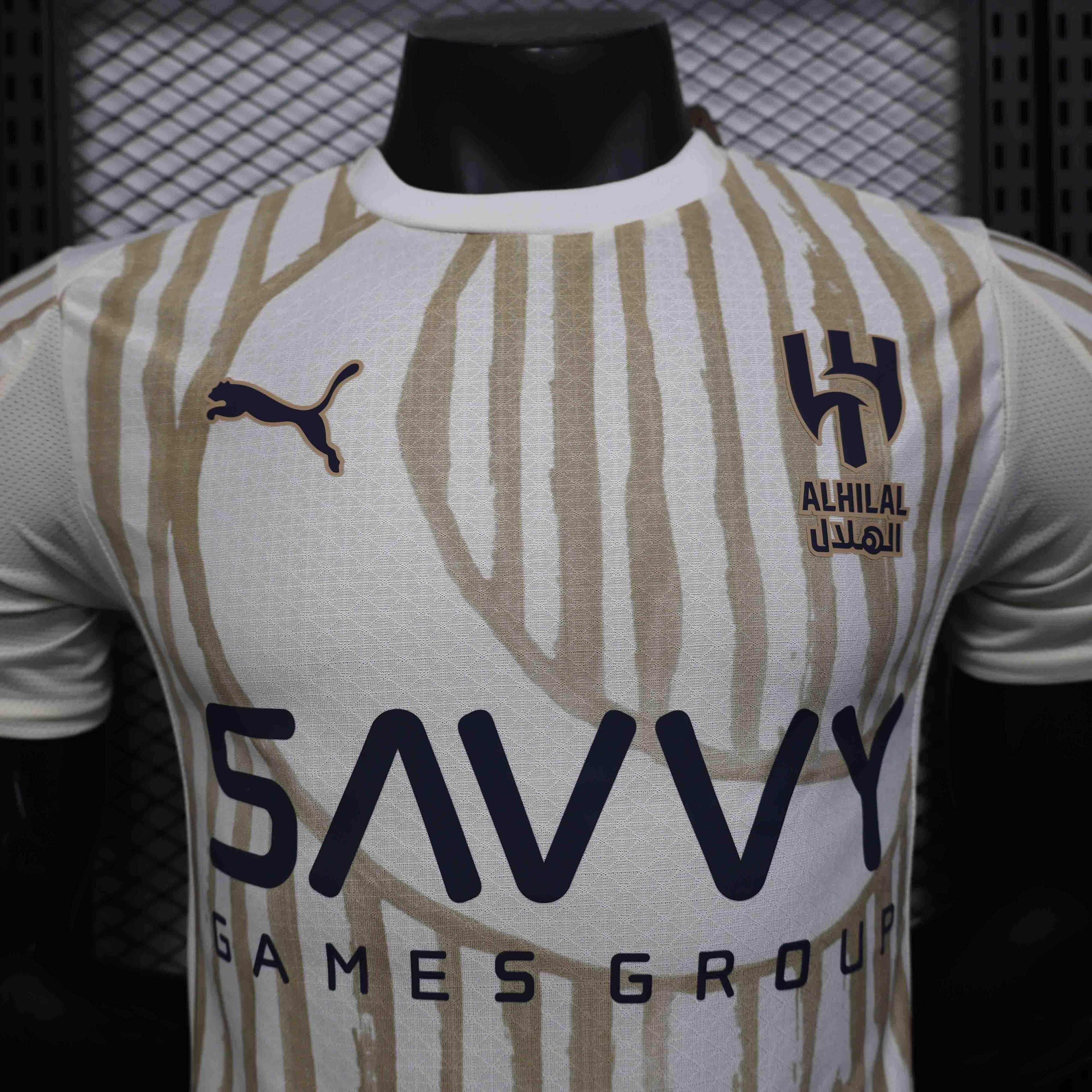 Maillot extérieur de football Al-Hilal 2025-26, marque Le 12 –ème Maillot, vue de face avec logo et design coloré.