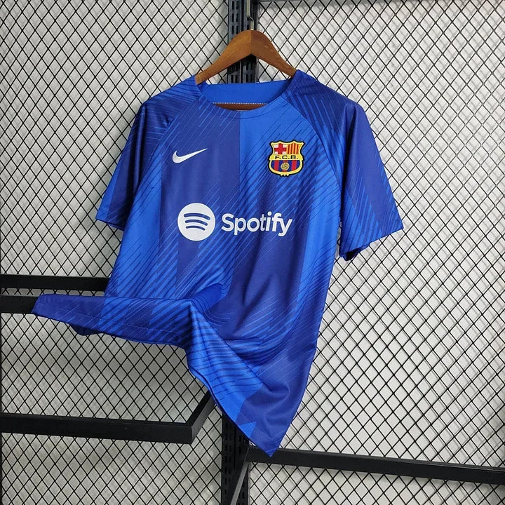 Maillot d'entraînement FC Barcelone 2023-2024 Le 12-ème, maillot de sport bleu avec logo du club.