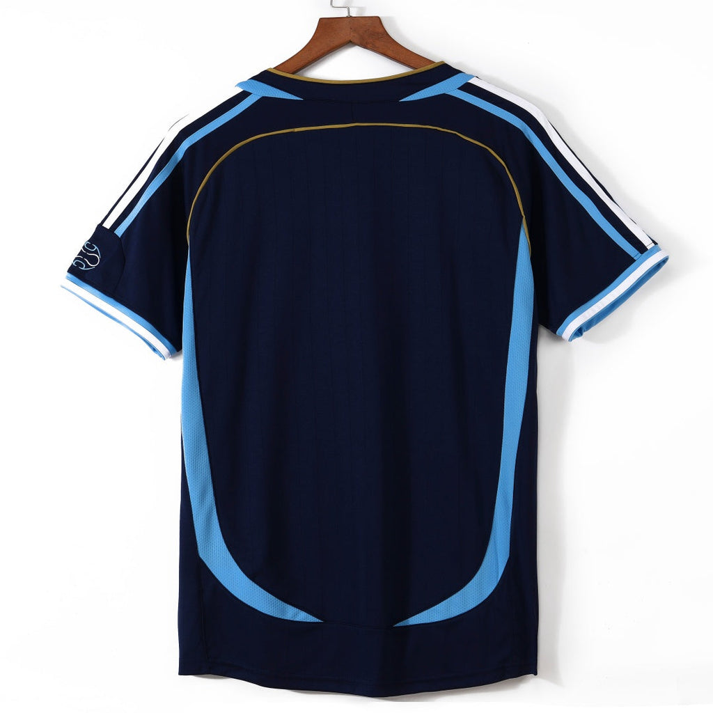 Maillot extérieur rétro de l'Argentine 2006, marque Le 12, avec le logo de la sélection et design classique.