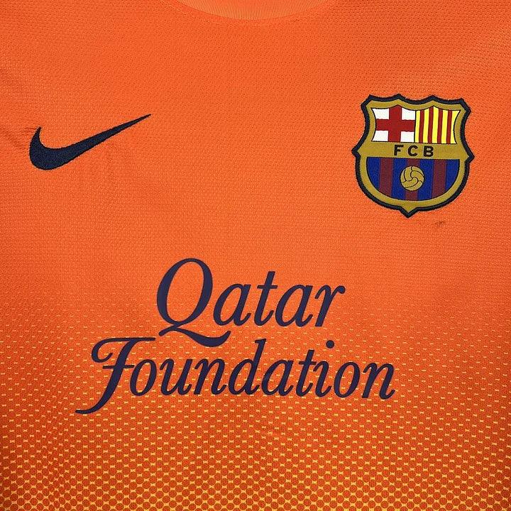 Maillot de football FC Barcelone 2012-2013 rétro, marque Le 12-ème, vue de face avec logo et détails du maillot.