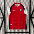 Maillot de football Haiti Third 25/26 Le 12 -ème Maillot, maillot orange avec logo national et détails en bleu.