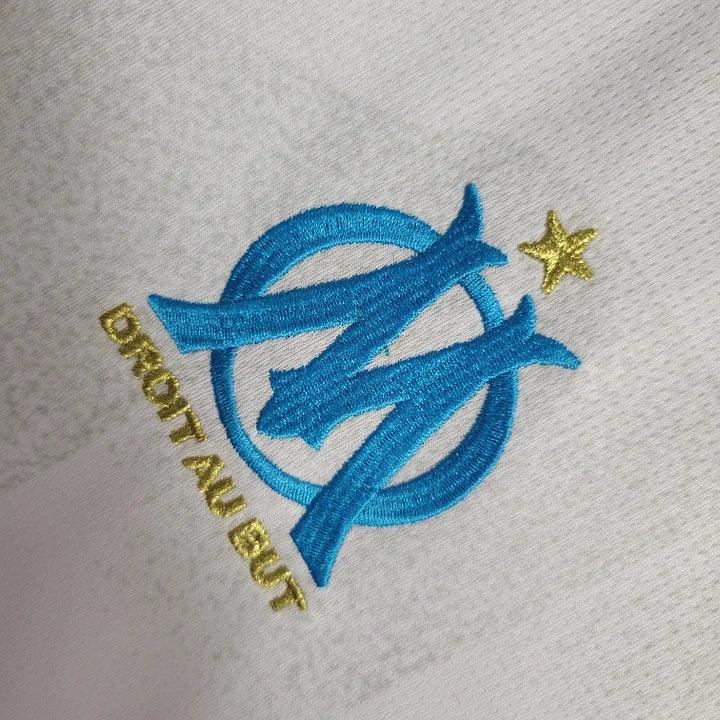 Maillot domicile Olympique de Marseille 2023 2024 de la marque Le 12 -ème Maillot, vue de face avec logo et détails du maillot.