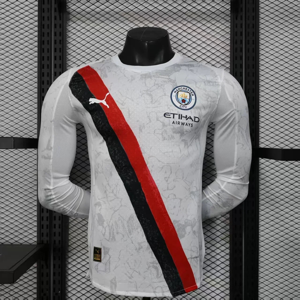 Maillot extérieur à manches longues Manchester City 2025-26, marque Le 12-ème, visible avec logo et design officiel.