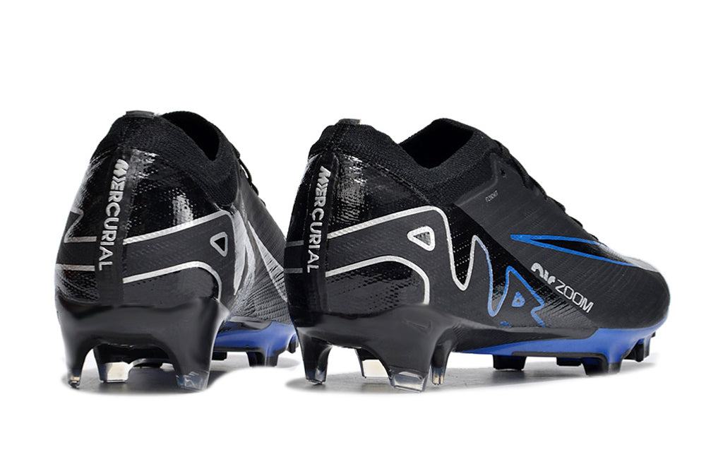 Crampons Mercurial Vapor 15 Elite XXV FG pour football, semelles cloutées, conçus pour performance sur terrain en herbe.