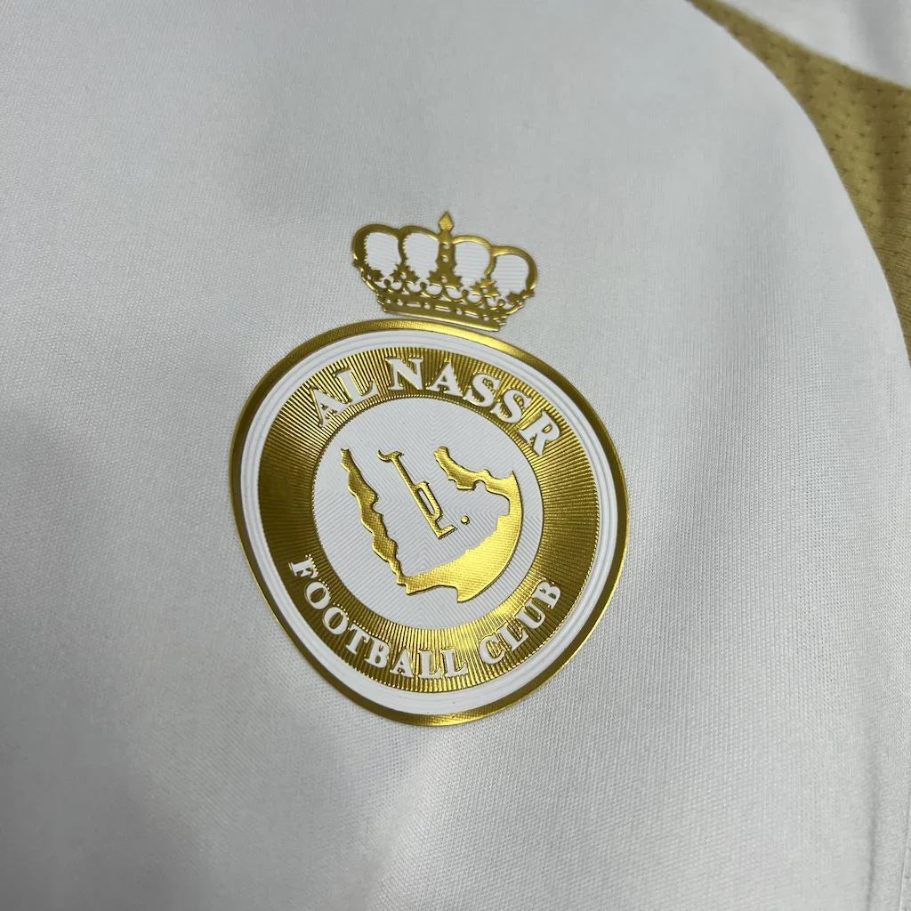 Maillot domicile AL NASSR 24/25, maillot de football Le 12-ème, en bleu avec logo de l'équipe et détails de design.