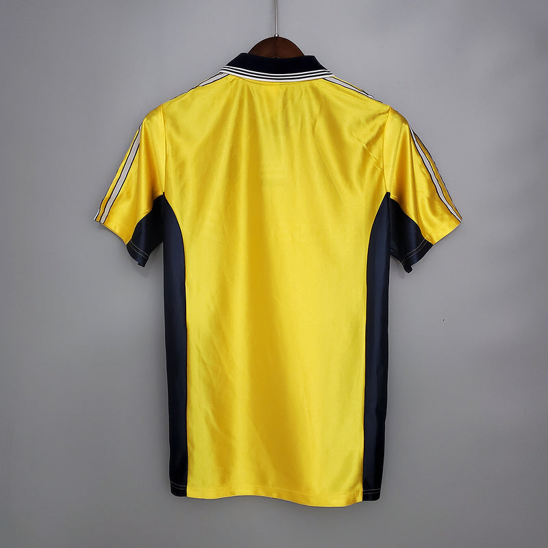 Maillot extérieur rétro Olympique de Marseille 1998-1999, marque Le 12-ème Maillot, vue de face avec logo et détails du maillot.