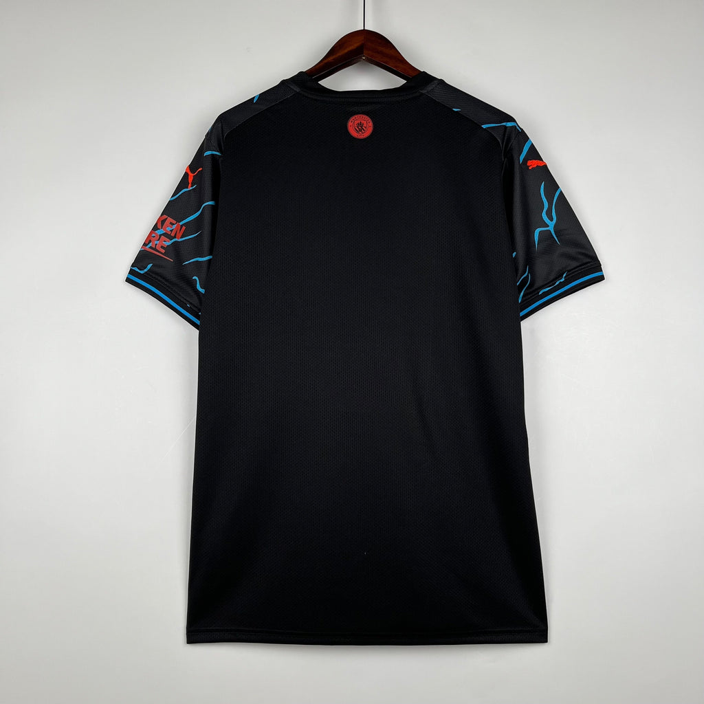 Maillot spécial Manchester City 2023-2024, marque Le 12 -ème Maillot, vue de face avec détails du design.