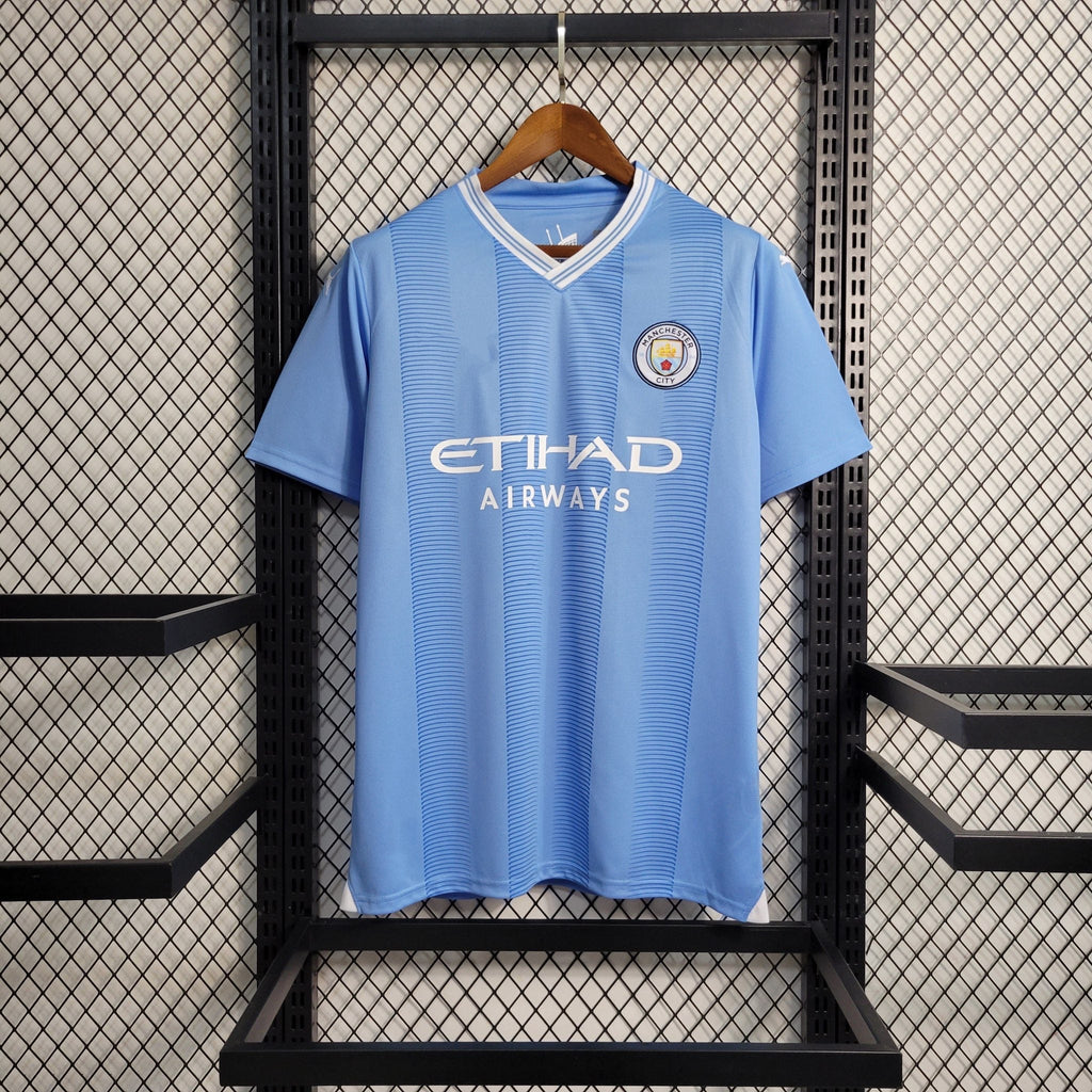 Maillot domicile Manchester City 2023-2024 Le 12-ème Maillot, devant avec logos et design officiel.