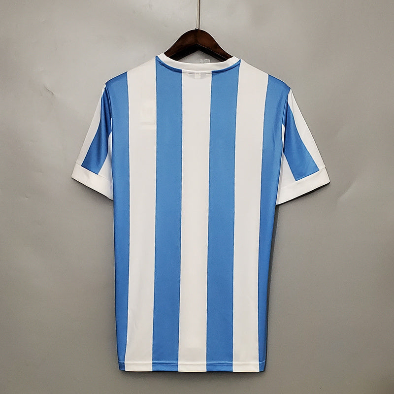 Maillot Argentine de la Coupe du Monde 1978 Le 12 -ème Maillot, rétro avec logo et détails vintage visible sur l'image.
