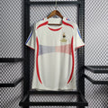 Maillot rétro de l'équipe de France 2006, modèle Le 12 -ème Maillot, vue de face avec logo et détails traditionnels.