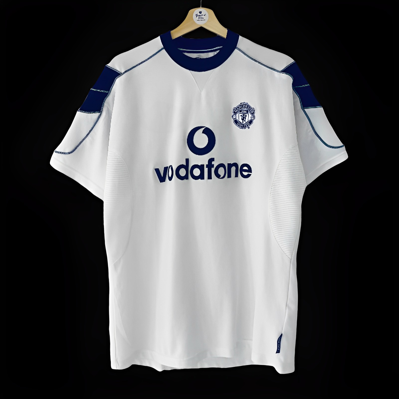 Maillot extérieur rétro Manchester United 2000-2001, marque Le 12-ème Maillot, vue de face avec logo et détails du maillot.
