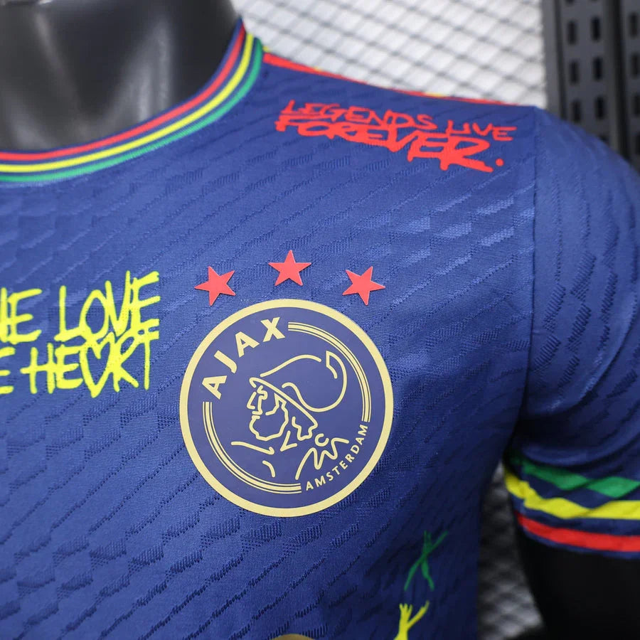Maillot Concept Amsterdam 2025 Le 12 -ème Maillot, vue de face, tissu coloré avec logo visible et détails de conception.